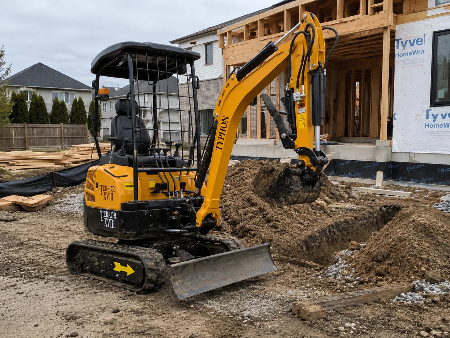 TYPHON TERROR XVIII mini excavator on a small construction site